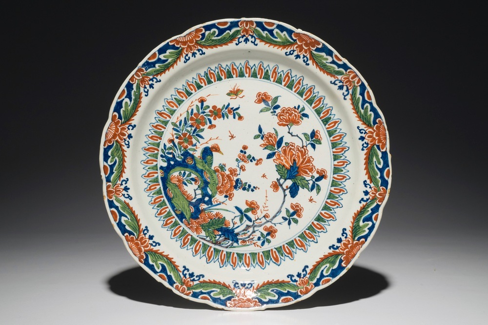 A Dutch Delft cashmire palette dish with a bird and insects among flowers, 1st half 18th C.
